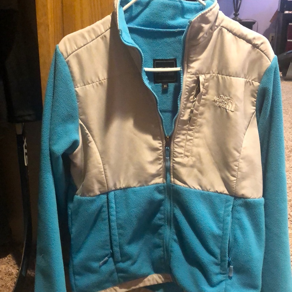 Blue and gray North Face jacket
